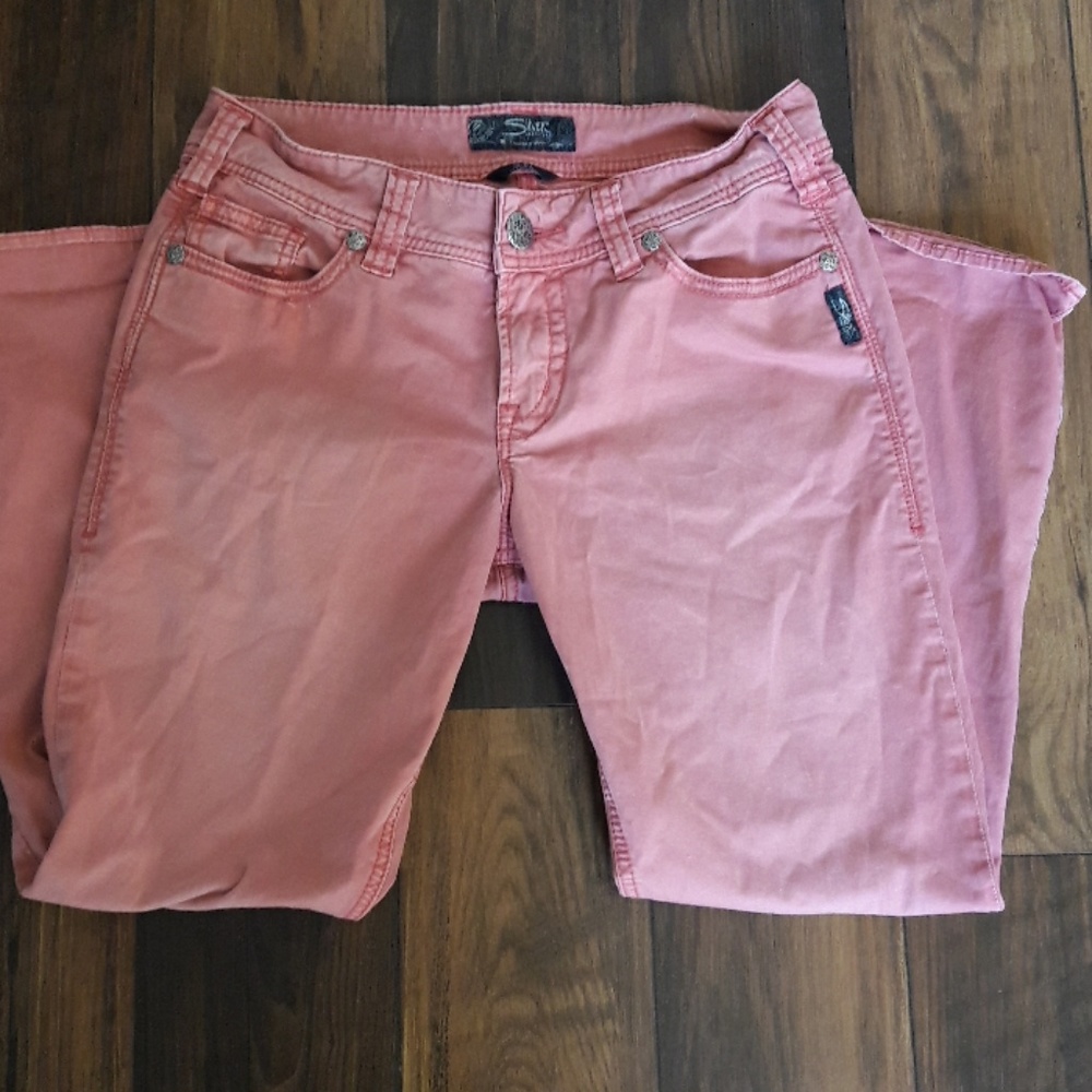 Faded red jeans